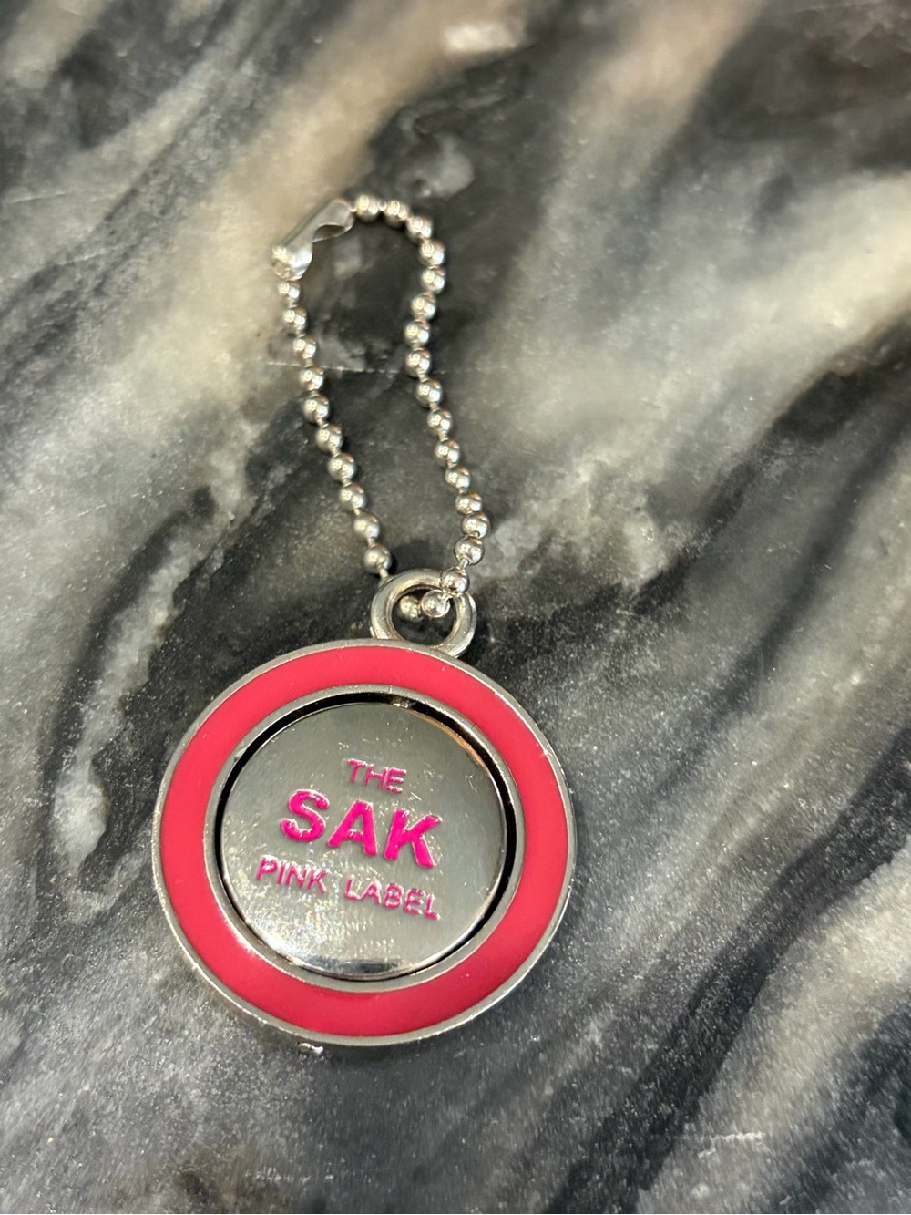The Sak Silver Tone Keychain with Pink Enamel Ring